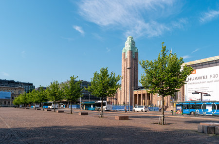 Helsinki, Finland - June 21, 2019: View of the clock tower of the Helsinki Central Station from Railway Square.のeditorial素材