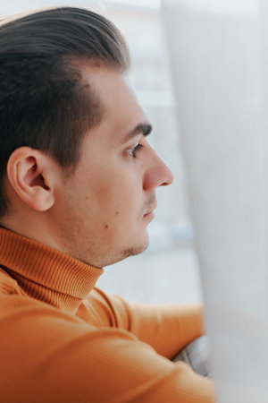 Profile of a young handsome guyの写真素材