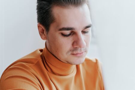 The young guy is sad. He looked downの写真素材