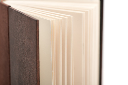 Open book pages on white background, close-up.の写真素材