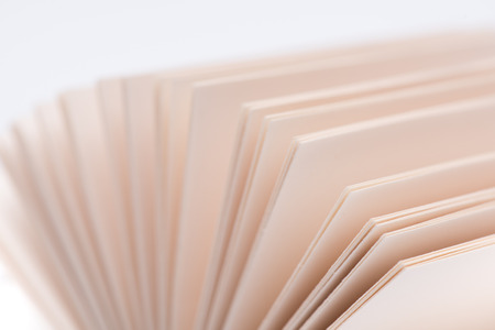 Open book pages on white background, close-up.の写真素材