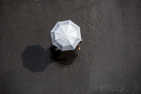 People with Umbrella in the Rain, Bird's Eye View.の写真素材