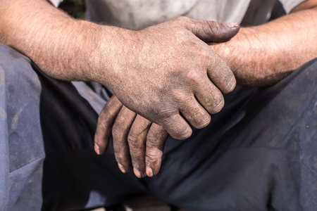 Charcoal-burners worker man with dirty hands.の写真素材