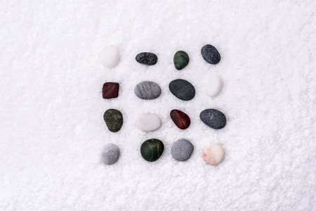 Spa treatment scene stones, stones on a white towel, soft background.の写真素材