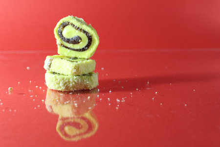 Marmalade or pastila lies tower or on top of each other on a red background with a place of a copy of the space.の写真素材
