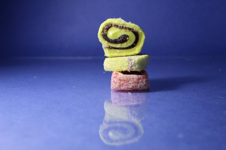 Turkish rahat onion pastila is a slide stack on top of each other on a blue background copyspace place for text.の写真素材