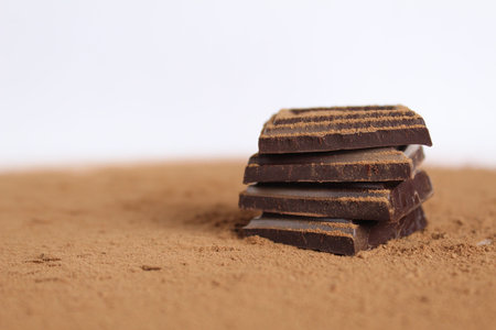 Chocolate bar pieces lie a stack of slides on each other day chocolate kind of side with space for...