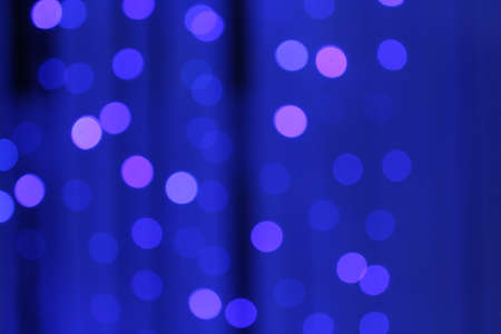 blue blurry background with garland. New Year Christmas.の写真素材