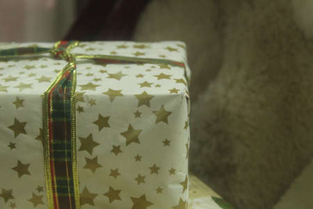 New Year Christmas gifts decorated with gift paper and bows. Festive atmosphere.の写真素材