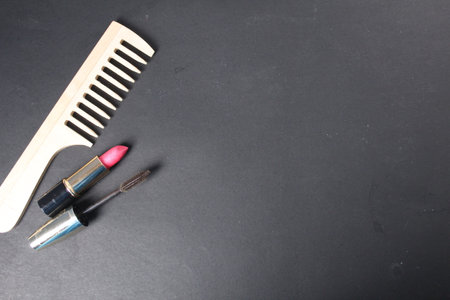 Morning makeup. Mascara Lipstick on a black background with space for copyspace text. Beauty.の写真素材