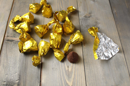 Chocolate candy and wrapper for packaging. Packaging of homemade sweets process.の写真素材