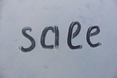 The word sale on a white background. Handwritten word sales.の写真素材