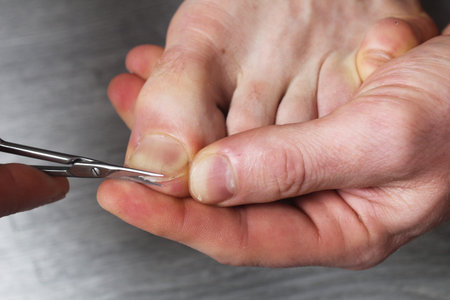 cutting off toenails close-up. Pedicure at home.の写真素材