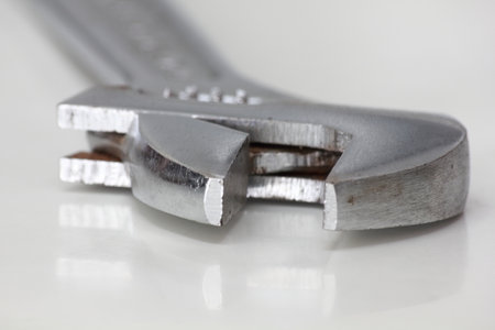 Adjustable spanner on white background. Close-up image.の写真素材