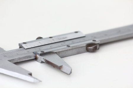 Vernier caliper on a white background. Studio shot.