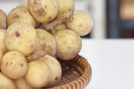 Wollongong or Lansium domesticum in basket on table