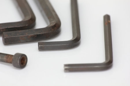 Set of metal tools on a white background. Close-up.