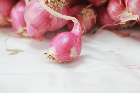 Shallots on white background. Shallow depth of field.