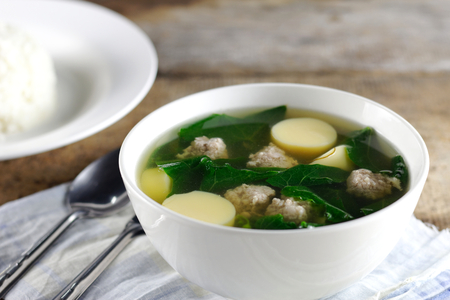 Vegetable gourd soup with minced pork and tofu with blur riceの写真素材