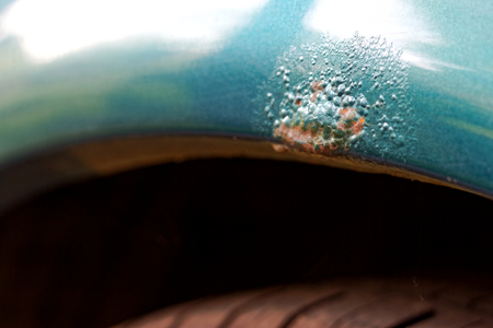 Car wheel arch is rusted and peeling paintの写真素材