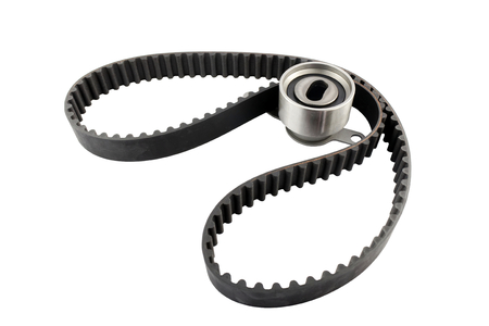 Timing belt and tensioner bearing isolated on white background.Automobile spare partの写真素材