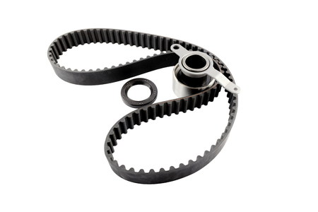 Timing belt ,crankshaft seal and tensioner bearing isolated on white background.Automobile spare partの写真素材