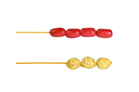 Fried Meatballs and sausage on a stick isolated on white backgroundの写真素材