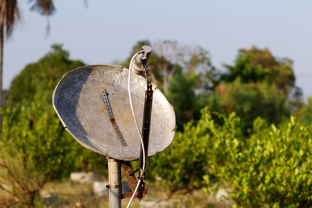 Homemade satellite dish made from old aluminium basinの写真素材