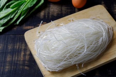Thai died rice noodles on wood board,Uncooked