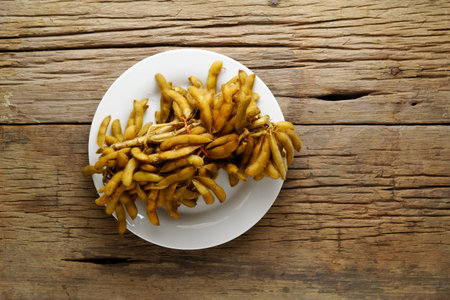 Boiled Thai edamame with salt on white plateの写真素材