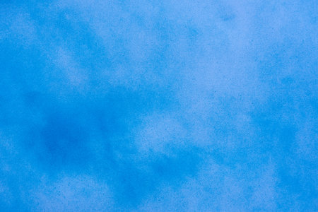 Abstract blue spray paint on paper texture backgroundの写真素材