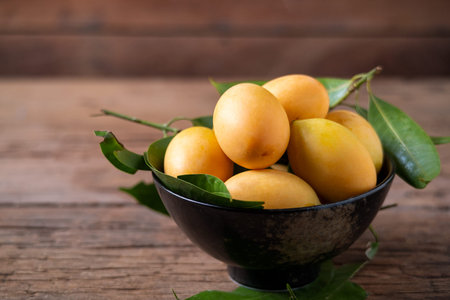 Thai plango fruit or marian plum on wood plate
