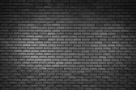 Dark decorative brick wall texture backgroundの写真素材