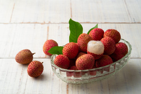 Close up Lychee fruits in glass bowl background