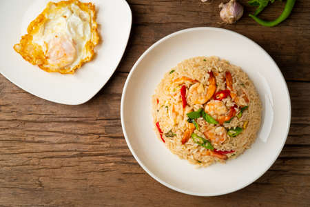 Thai fried rice with shrimp and basil with fried egg.Top viewの写真素材
