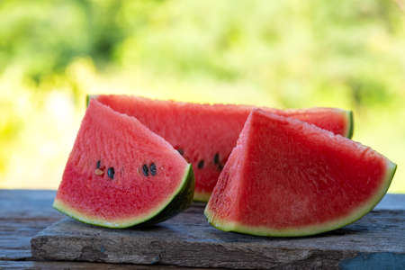 Fresh sliced watermelon on wooden backgroundの写真素材
