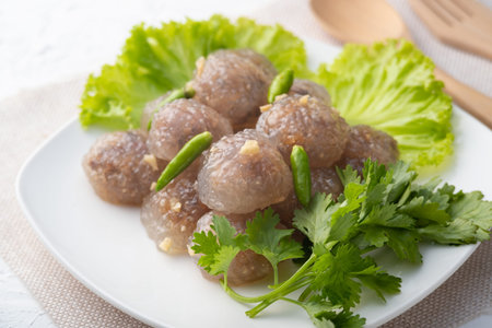 Tapioca Balls with Pork Filling on white plate.