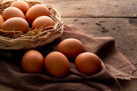 Close up Chicken eggs on wooden plate background