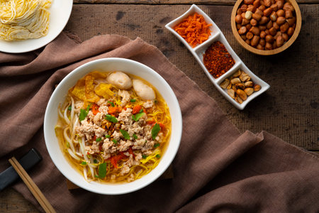 Tom Yum noodle soup ,Egg noodles with Minced Pork and meatball.popular hot and spicy soup in...