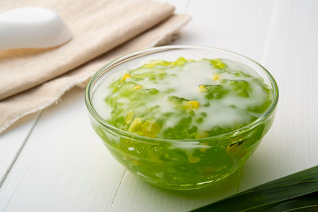 Pandan flavoured Tapioca pearl pudding (Sago) with a dash of coconut milk,popular South-East Asian dessert in glass bowlの写真素材