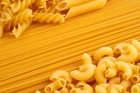 Close up elbow macaroni pasta and spaghetti for background.Selective focusの写真素材