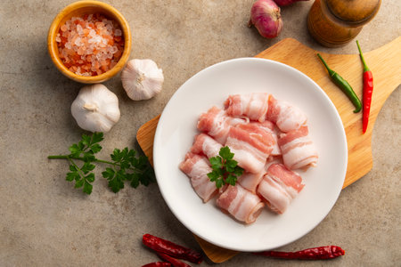 Raw fresh pork thin,Rolled sliced pork belly in white plate.Top view.の写真素材