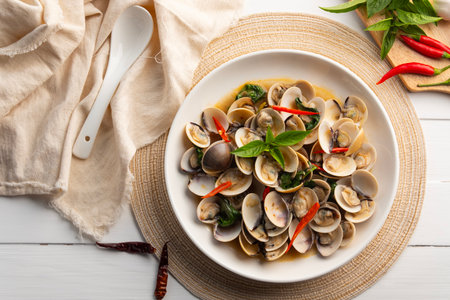 Stir Fried Clams with Sweet Basil in a plate.Thai food.(Puff meretrix or Meretrix casta)の写真素材