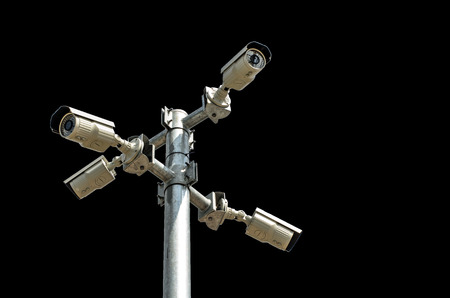 Four Security camera isolated on black backgroundの写真素材
