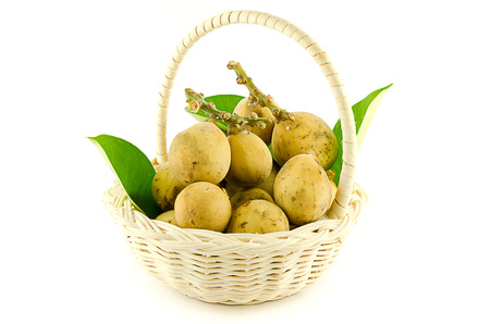 Langsat, Duku in basket on white backgroundの写真素材