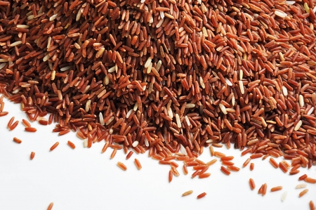 Red rice on white backgroundの写真素材