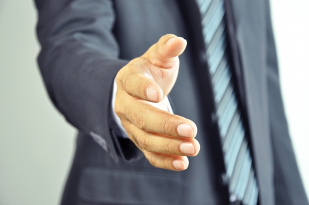 Businessman reaching hand offering handshakeの写真素材