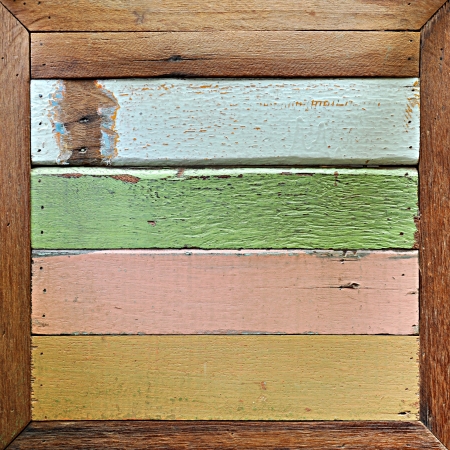 Retro colorful wood background in wooden frameの写真素材