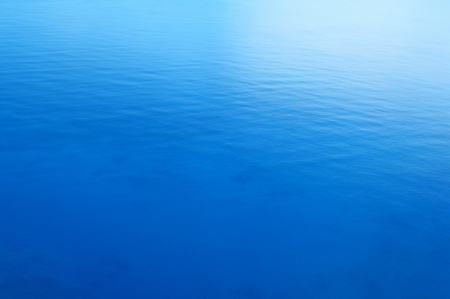 Tranquil blue sea water backgroundの写真素材