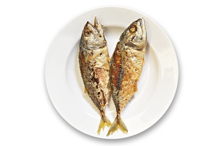 Thai style fried mackerel fish in white dishの写真素材